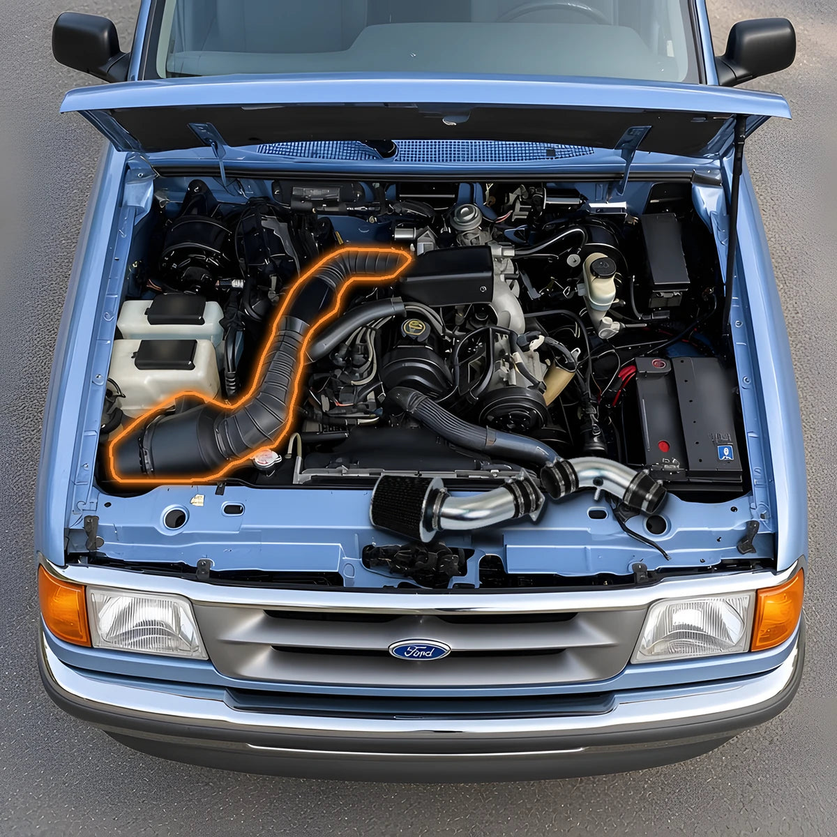 1995-1997 Ford Ranger 2.3L engine bay with the stock airbox and intake tube outlined, next to the replacement cold air intake