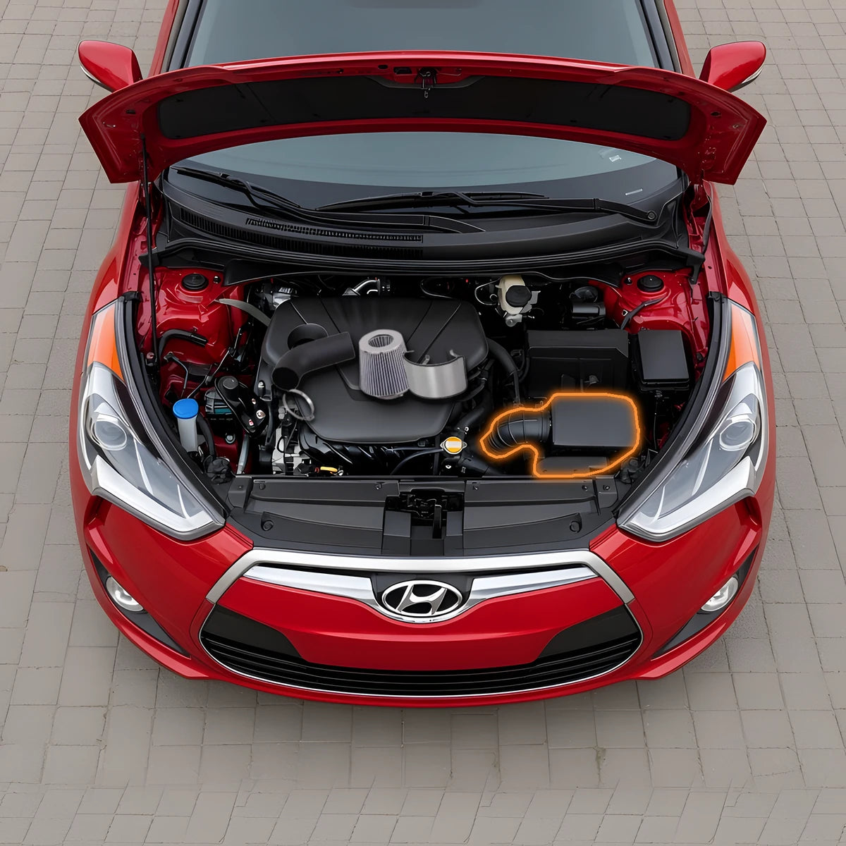 Cold air intake kit on top of a 2012-2013 Hyundai Veloster 1.6L engine bay, stock airbox and intake tube highlighted for replacement