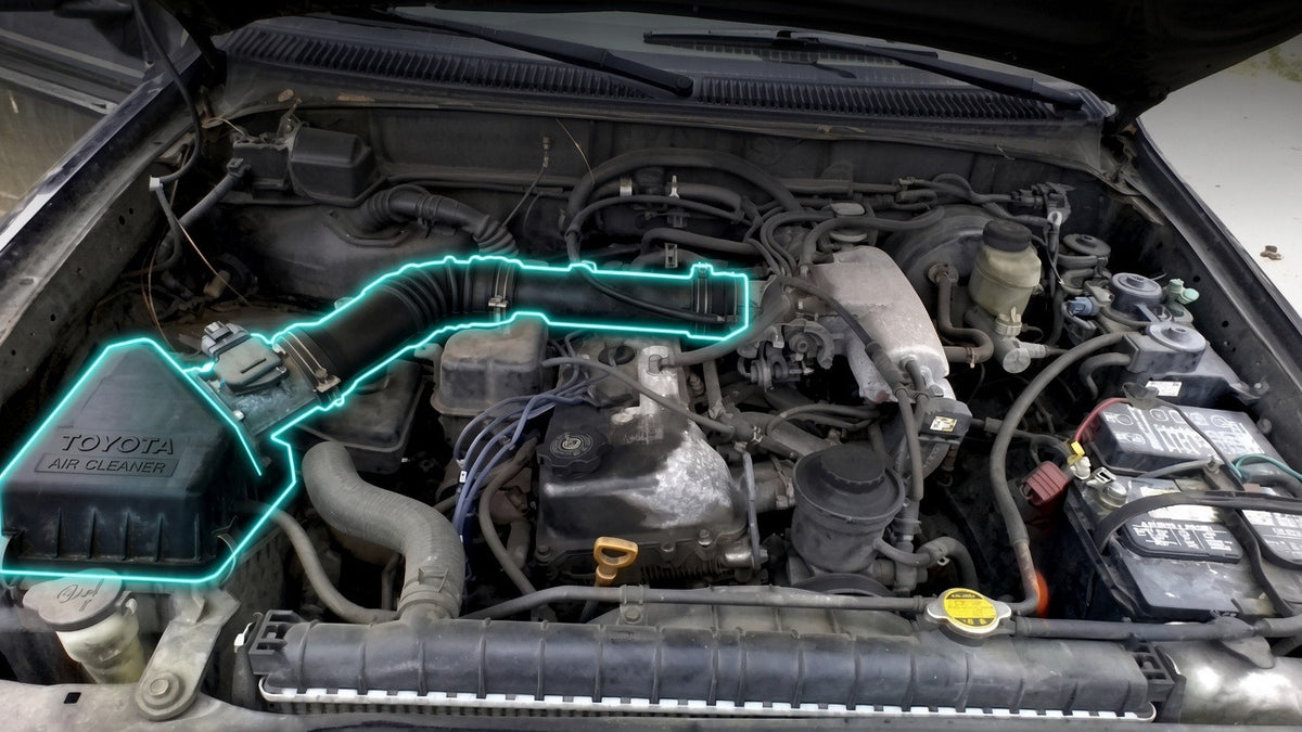 Toyota Tacoma 1999-2004 3.4L engine bay with the air box and intake pipe highlighted