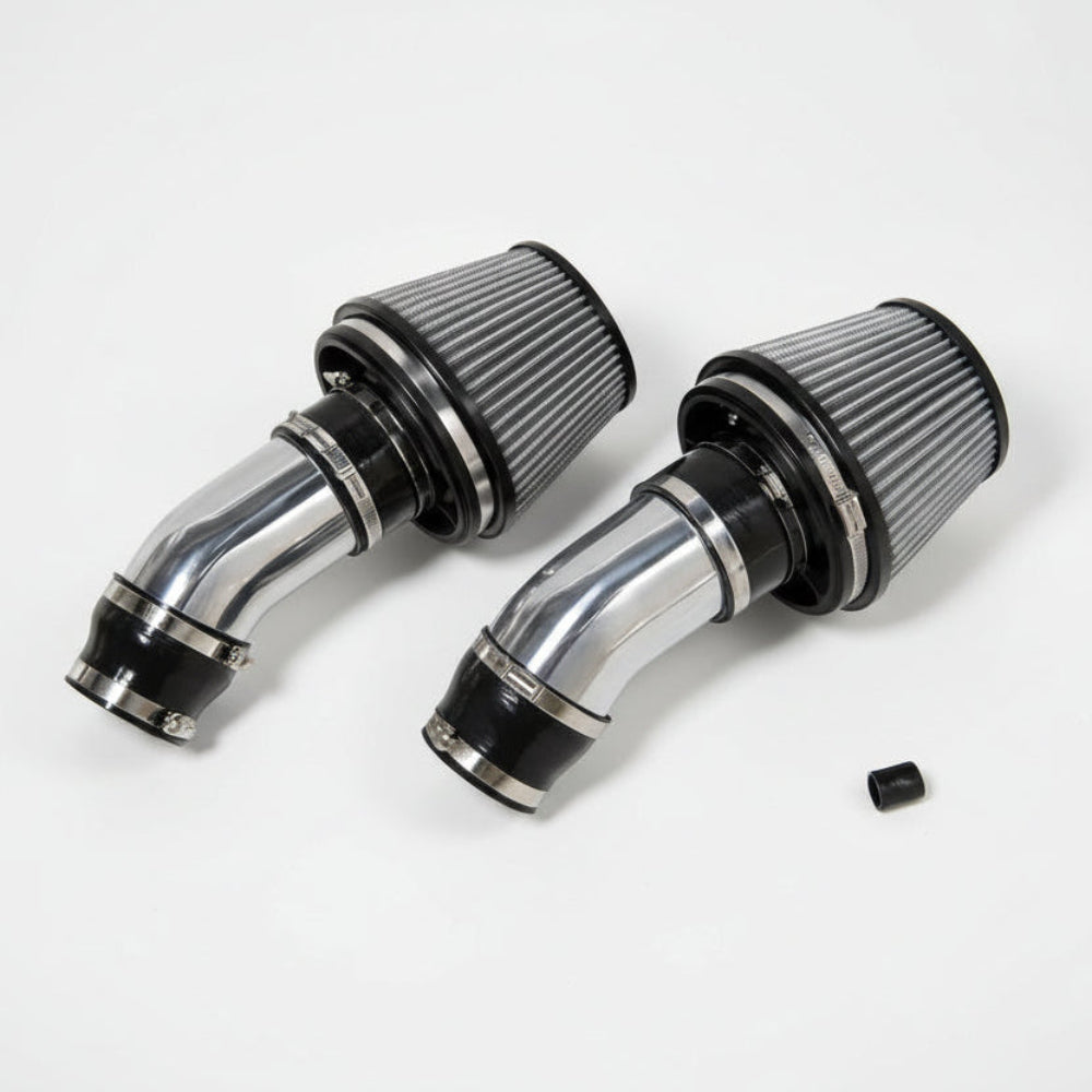 Two chrome air filters on a white background