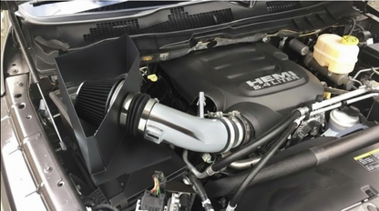 Car engine with a HEMI logo, showing the air intake system. 6.4L