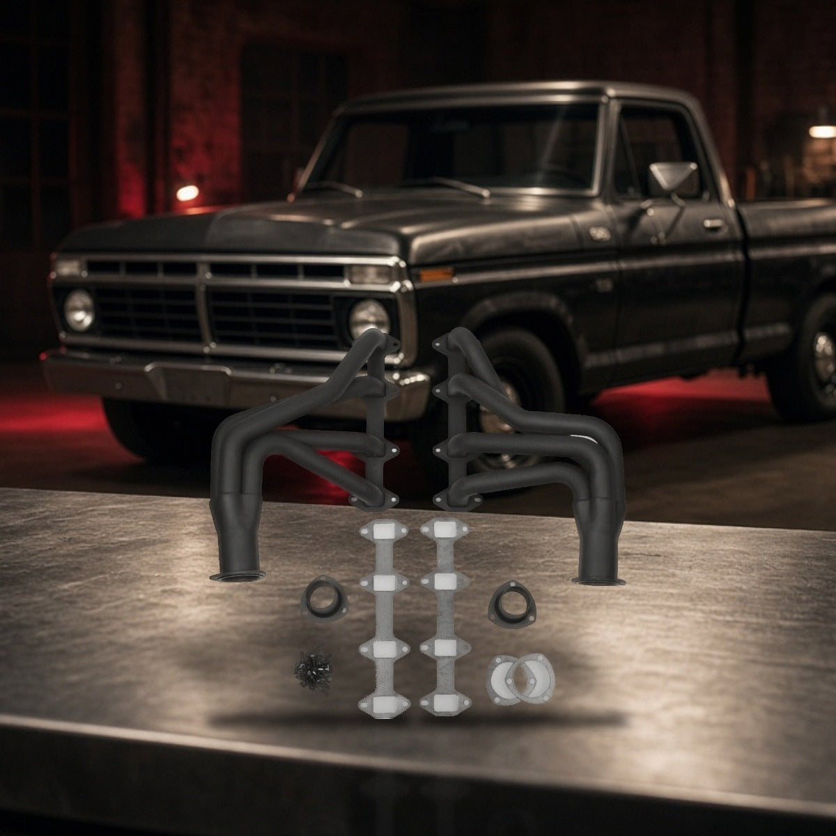 Long Tube Headers For Ford F-100 F-150 (1965-1974) Black on a garage workbench