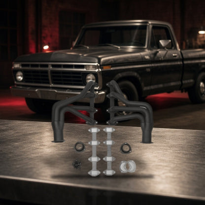 Long Tube Headers For Ford F-100 F-150 (1965-1974) Black on a garage workbench