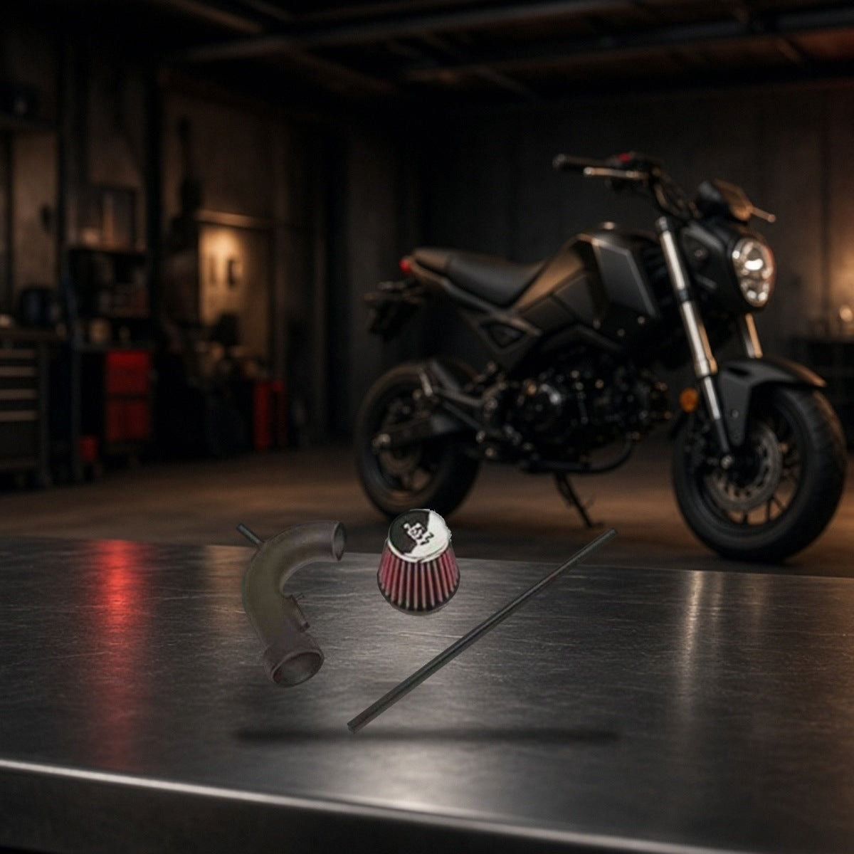 Short Ram Air Intake for Honda GROM SF (2013-2020) on a garage workbench