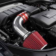Car engine with a metallic air intake system and red filter