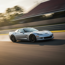 A square image of a Corvette C6 2008-2013 driving fast showing speed and excitement