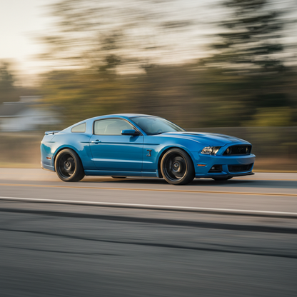 A square photo of a 2011-2014 Ford Mustang driving fast showing speed