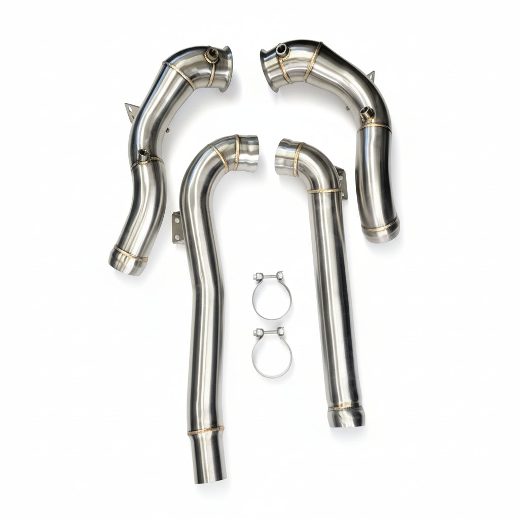Set of metallic exhaust pipes on a white background