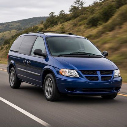 Blue 2001-2007 Dodge Caravan minivan driving fast on a highway