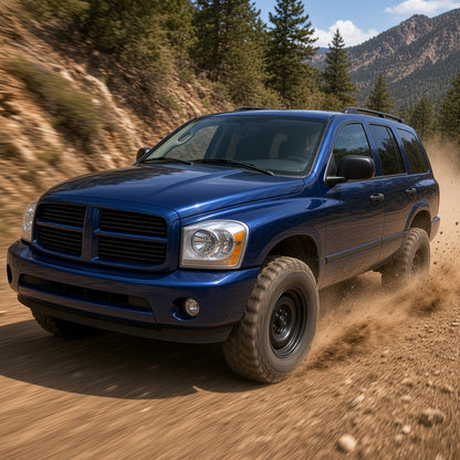 Blue Dodge Durango driving fast on a dirt trail