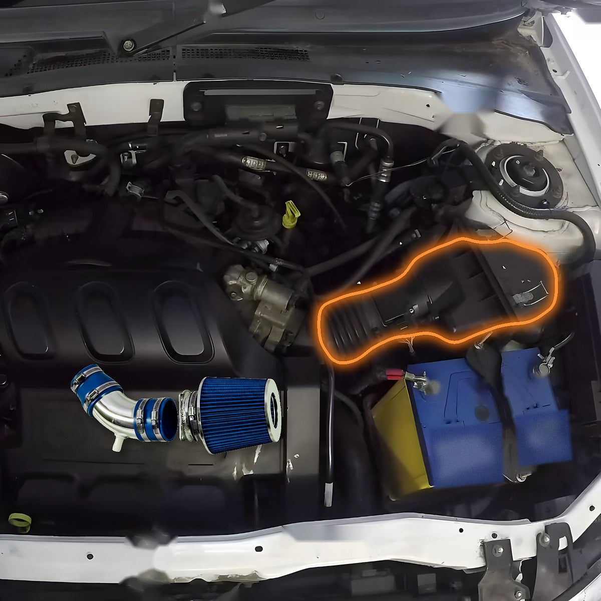 2001-2004 Mazda Tribute 3.0L V6 engine bay with the stock airbox and intake duct highlighted, and the cold air intake kit shown at scale