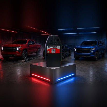 Stage 1 performance chip on a pedestal with a Chevrolet Silverado, Camaro and Tahoe in a dyno shop