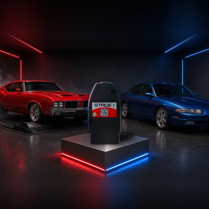 Stage 1 performance chip on a pedestal with an Oldsmobile 442 and Aurora in a dyno shop