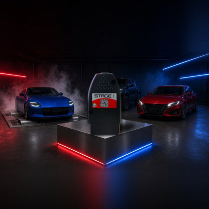 Stage 1 performance chip on a pedestal with a Nissan Z, Frontier and Altima in a dyno shop
