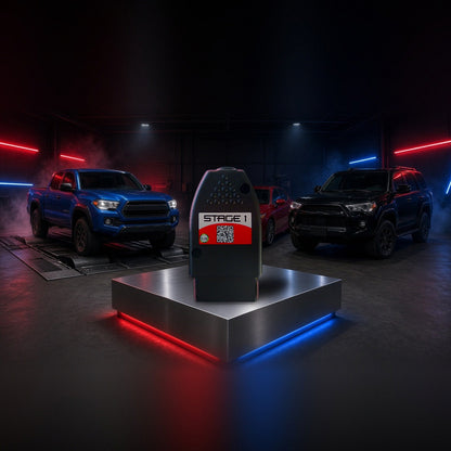 Stage 1 performance chip on a pedestal with a Toyota Tacoma, Camry and 4Runner in a dyno shop