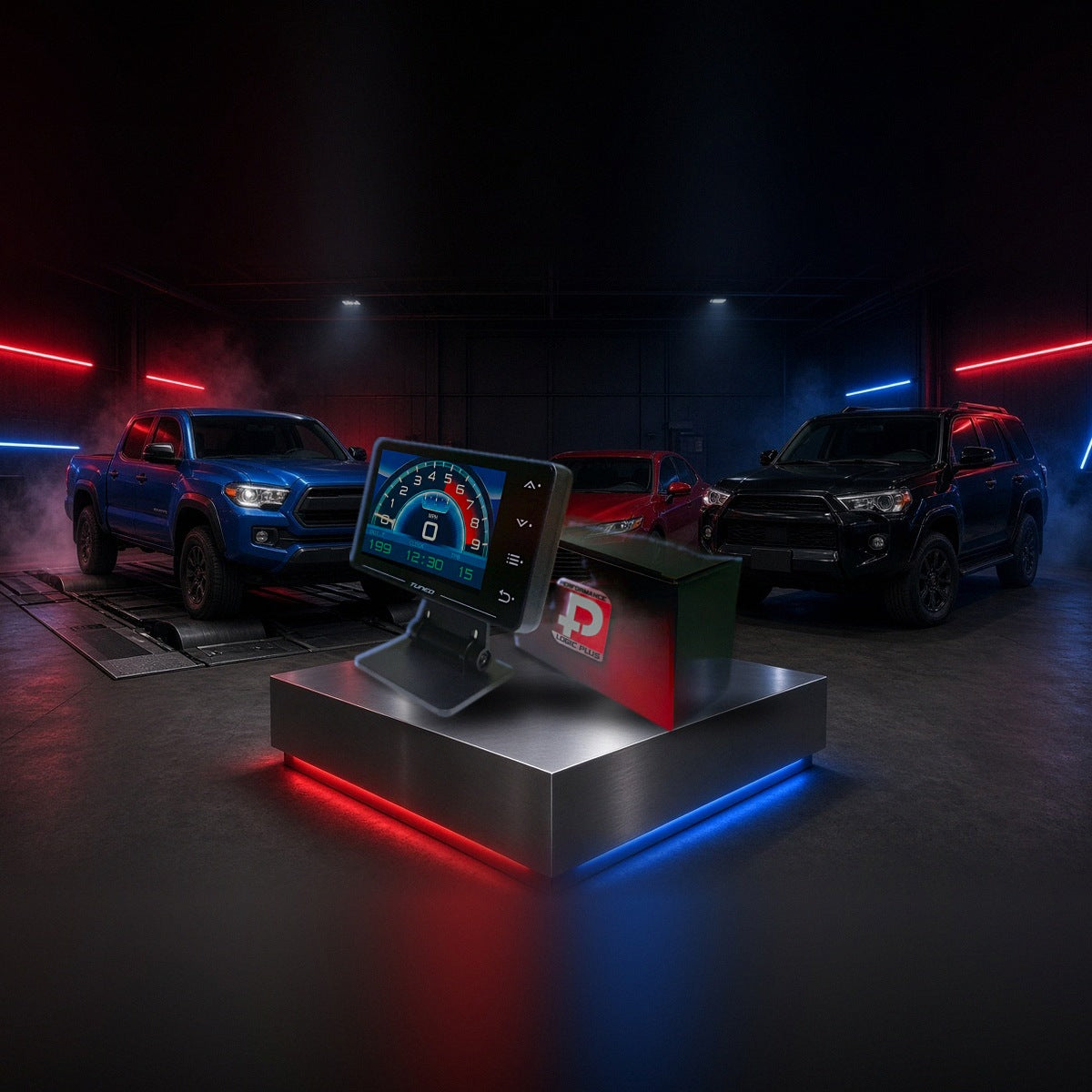 Stage 4 performance tuner on a pedestal with a Toyota Tacoma, Camry and 4Runner in a dyno shop