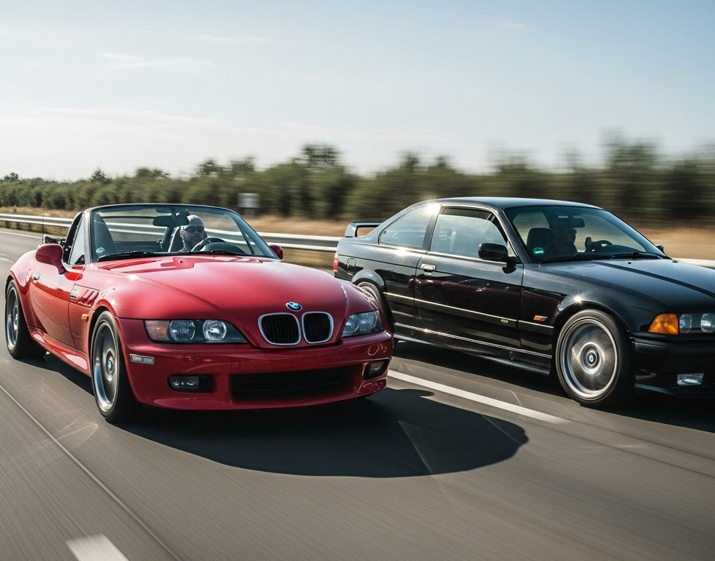 Red BMW Z3 roadster and black BMW E36 coupe driving fast